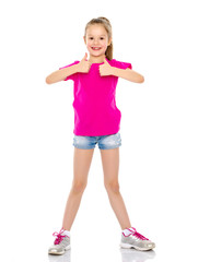 Naklejka premium Little girl holding her thumb up