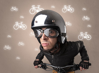 Young ridiculous biker with line drawn bikes on the background