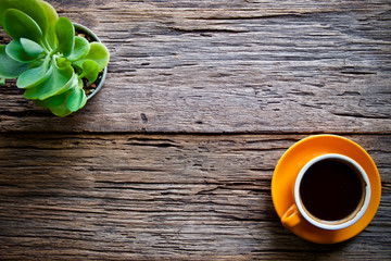 Coffee cup hot and notebook pen on wooden table desk 