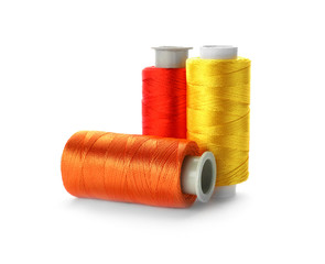 Color sewing threads on white background
