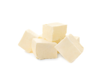Cubes of tasty fresh butter on white background