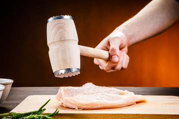 Raw chicken fillet on cutting board