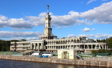 Fototapeta na wymiar Russia, Moscow, river station building, North river port in summer against the blue sky with clouds - travel, tourism, excursions