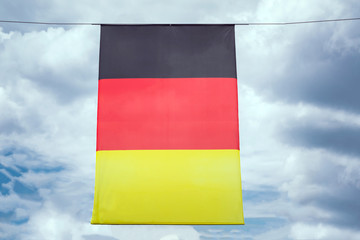 background from the flag of Germany, developing against the sky and clouds