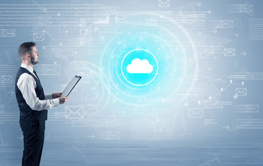 Standing businessman with data around and highlighted icon on the centre
