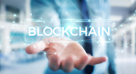 Businessman using blockchain cryptocurrency interface 3D rendering