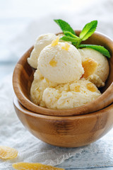 Artisanal ginger ice cream in a wooden bowl.