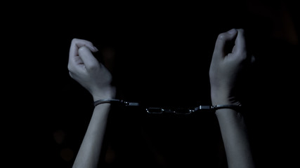 Handcuffed victim of serial killer trying to break free, violence and hostage