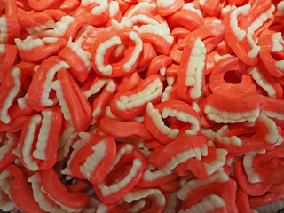 Close up of bowls filled with a large selection of different colored soft candies
