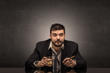 Young drunk man at his office with free dark copyspace