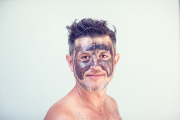 Handsome man with black face mask on his face