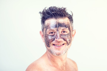 Handsome man with black face mask on his face