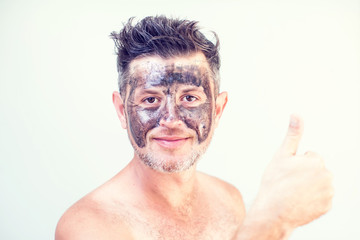Handsome man with black face mask on his face