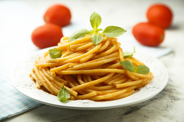 Pasta with tomato sauce and fresh basil