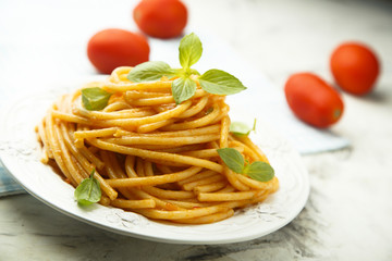 Pasta with tomato sauce and fresh basil
