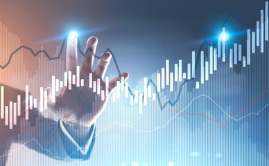 Businessman hand touching a graph hologram