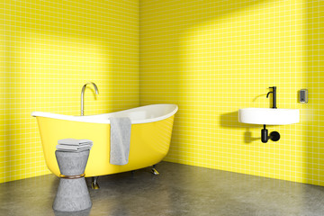 Yellow bathroom corner with a chiar