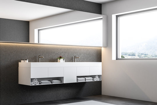 Black mosaic wall bathroom, double sink side view