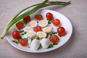 natural nutritious diet vegetable salad of tomatoes and quail eggs