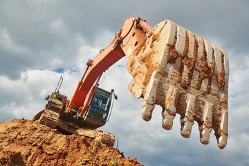 excavator loader machine earthmoving soil at construction site