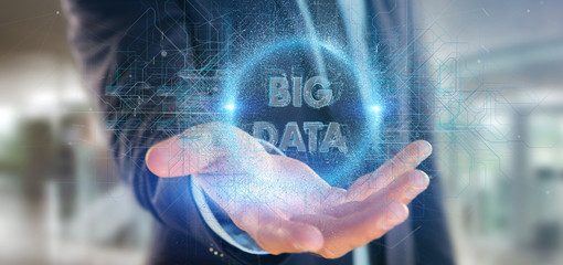 Particles big data title holding by a businessman