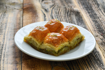Turkish sweet baklava on plate.