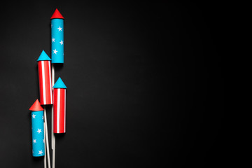 July 4, rockets for fireworks on a blue red background with space for text. in the style of...