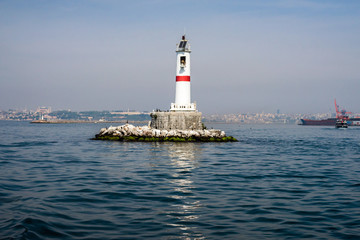A lighthouse on the water, a sunny day. Istanbul.
