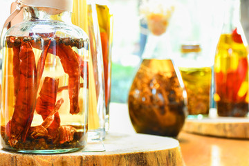 Spices and  herbs ingredients in decorative glass bottles,kitchen decoration