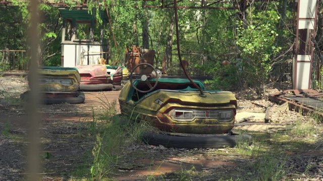 Abandoned amusement park, bumper cars in Pripyat. Chernobyl nuclear disaster. Slider shot - Juni 2017: 30km Chernobyl, exclusion zone