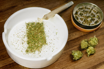 Ground weed in the shape of Indiana with a joint. (series)