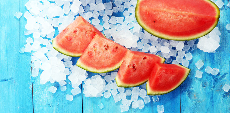watermelon on blue background. juicy summer fruit in slices