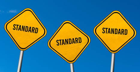 standard - yellow sign with blue sky