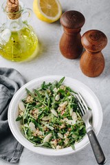 Quinoa salad with arugula and almonds. Vegetarian lunch bowl.