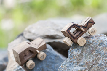 SUV toy car in nature / Wooden SUV, toy car in an extreme landscape.