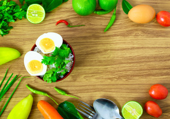boiled egg rice food clean eating selection placed on a wooden table.