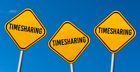 timesharing - yellow sign with blue sky