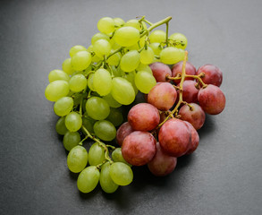 Grapes on dark background. Selective focus with shallow depth of field.