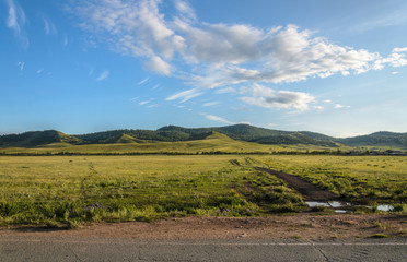 Sunny summer landscape, hills, forest, blue sky