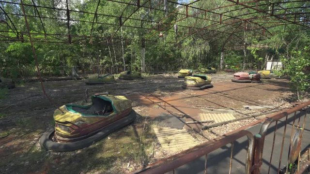 Abandoned amusement park, bumper cars in Pripyat. Chernobyl nuclear disaster. Slider shot - Juni 2017: 30km Chernobyl, exclusion zone