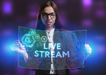 The concept of business, technology, the Internet and the network. A young entrepreneur working on a virtual screen of the future and sees the inscription: Live stream
