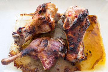 Appetizing grilled turkey shanks and chicken legs