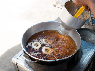 Donut fried maker making machine with stainless steel mold optional, frying sweet and tasty donuts on hot oil in a pan