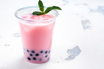 Refreshing homemade iced milky bubble tea with tapioca pearls