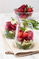 Spinach salad in glass.