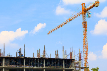 Fototapeta na wymiar construction workers site and building of housing at laborer work outdoor which has tower crane blue sky background with copy space add text