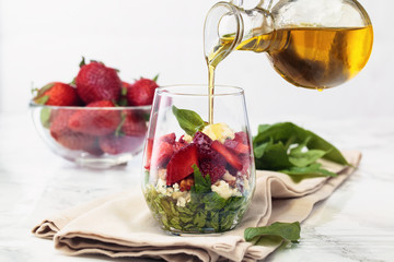 Spinach salad in glass.