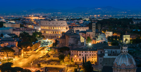 Amazing night panorama in Rome with the Colosseum and the Forum.