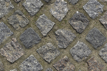 texture, background. The pavement of granite stone.