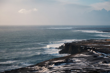 Winter scene of volcanic black sand beach on Iceland&rsquo;s dramatic coastline.